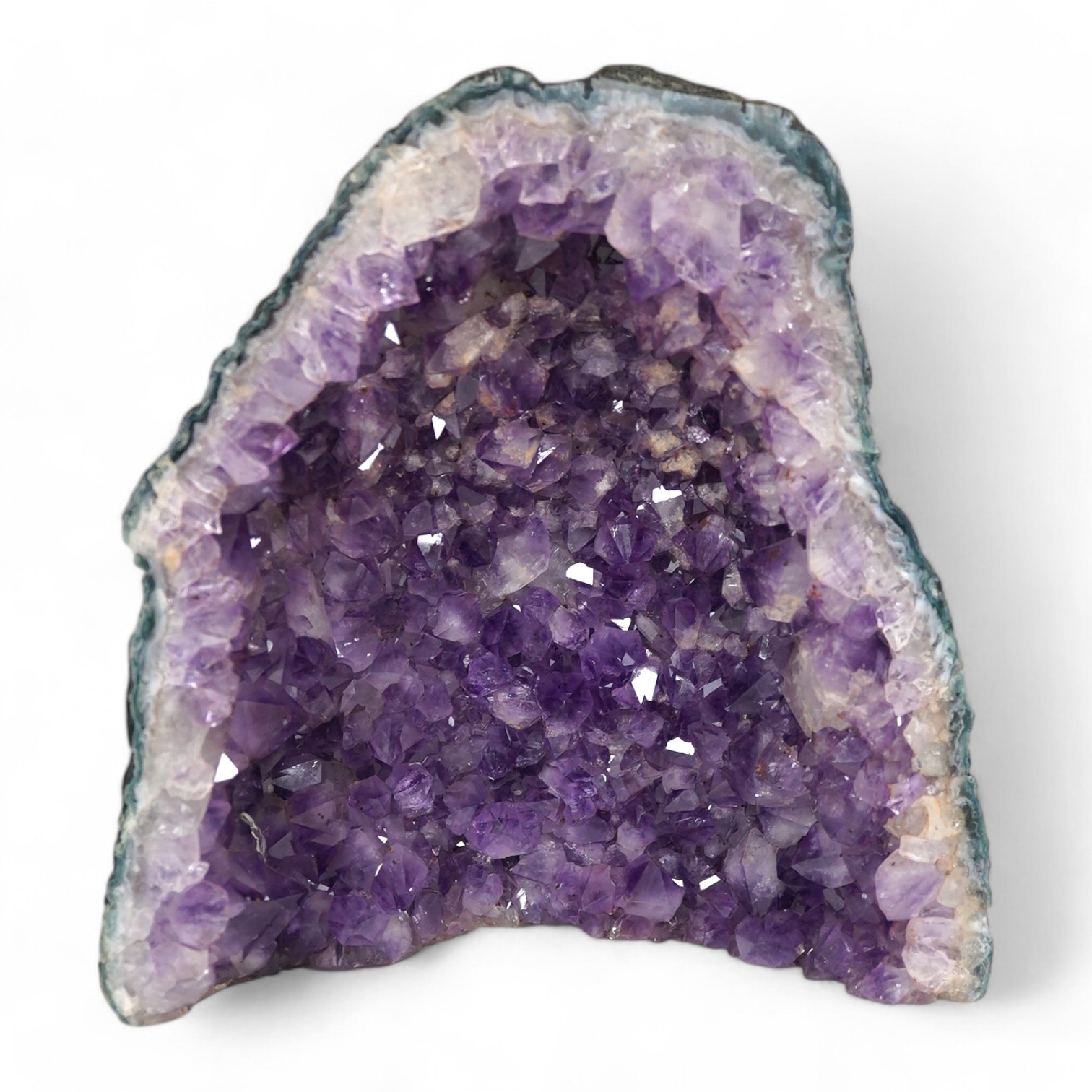 An amethyst geode specimen, 21.5cm high, 20.5cm wide at the base. Condition - fair to good.